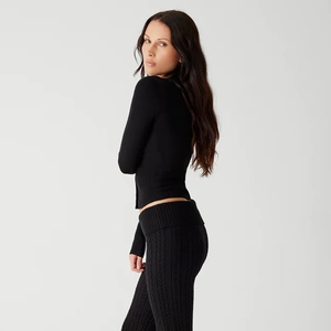 Slim fit black long sleeve cable knit sweater set for women with textured pants