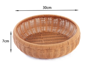 Detail showing 30cm diameter dimensions of the woven brown round storage basket