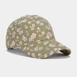 Detail of floral baseball cap with pink flower print on olive green cotton fabric