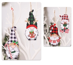 Detail of wooden Christmas gnome ornaments with plaid patterns hanging on white branches