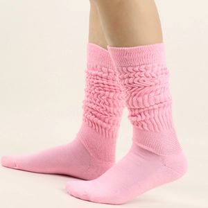 Detailed knit texture of pink slouch socks featuring a warm ribbed bubble weave design