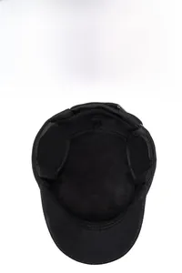 Detail view of winter flat top cap with thick black fleece lining and warm ear protection