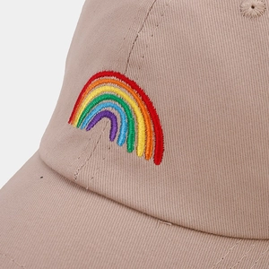 Macro shot of colorful rainbow embroidery on a khaki cotton twill baseball cap