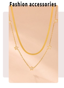 Close-up of double-layer gold necklace featuring star pendants with pavé-set zircons