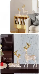 Macro detail of transparent gold foil deer sculptures with luxury golden antlers