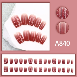 Gradient burgundy square press-on nails with white firework patterns and 24pc set display