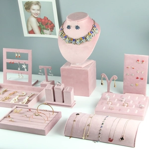 Pink velvet jewelry display set including necklace mannequin and ring tray stands
