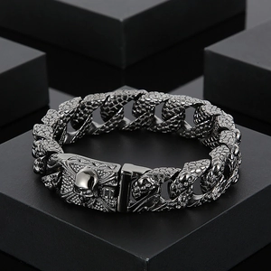 Detailed view of punk skull clasp and snake scale texture on titanium steel bracelet