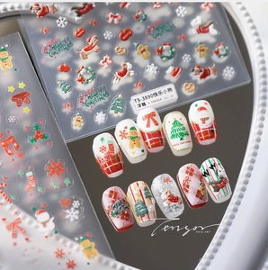 Detailed macro view of 3D embossed Christmas nail stickers featuring cute holiday puppies