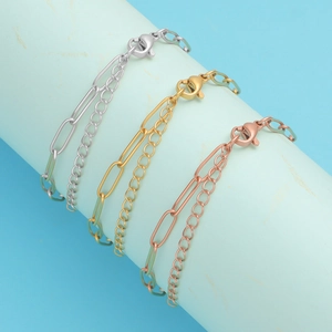 Three stainless steel paperclip bracelets in silver, gold and rose gold on a blue display