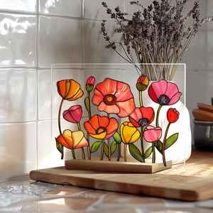 Detailed view of colorful 3D floral acrylic ornament with natural wood base on tile