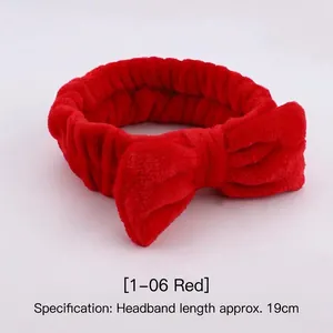 Detail of red plush coral fleece headband with bow, 19cm length for face washing