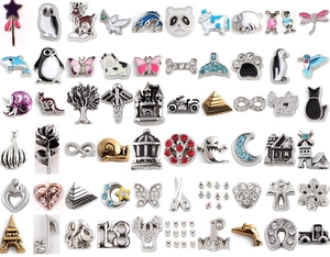 Macro display of diverse alloy and enamel DIY floating charms for charm lockets