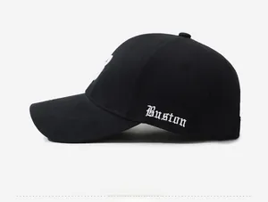 Side view showing white Buston embroidery on a black cotton baseball cap for men