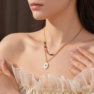 Vintage double layer gold necklace with colorful beads and sunburst star oval pendant