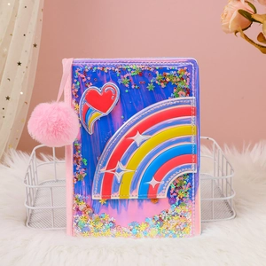 Detail of laser PU rainbow heart notebook with glitter sequins and pink pompom