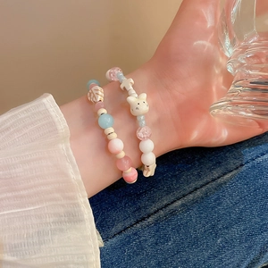 Cute beaded bracelet featuring cat charms and opal leaves for a sweet feminine style