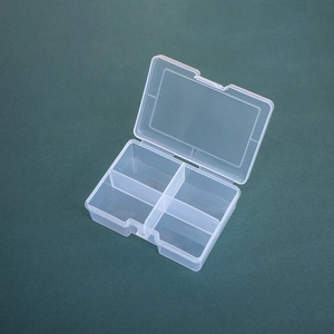 Macro shot of a 4-compartment clear PP storage box with snap closure for small parts