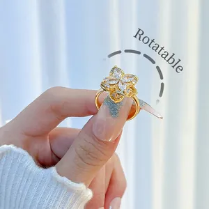 Rotatable flower ring in gold-plated copper with clear zircon stones for women