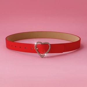 Detail of red leather belt featuring a heart-shaped buckle encrusted with sparkly rhinestones