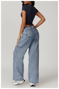 Rear view of tight-fitting athletic T-shirt and high-waist wide-leg jeans on a model