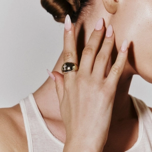 Professional photo of an 18k gold stainless steel cross ring with sparkling crystals