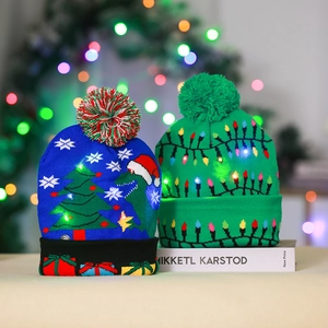 Festive LED knitted Christmas beanies with dinosaur and light bulb patterns in holiday setting
