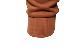 Detail of ribbed cuffs on caramel cotton polo sweatshirt showing fine knit texture