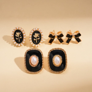 Vintage black enamel earring set with pearl details and golden floral accents