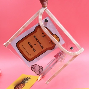 Close-up of a clear PVC pencil case featuring a white trim and snap button closure