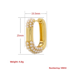 Detail showing dimensions of gold U-shaped pearl earrings with white pearl inlay