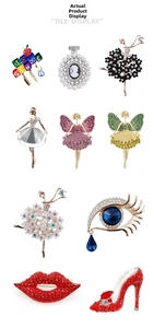 Detail display of crystal rhinestone brooches in ballet, lip, and eye shapes for accessories