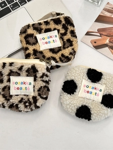 Three-piece plush faux fur mini pouches with leopard print and polka dots patterns