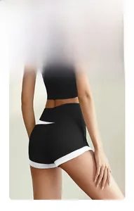 Close-up of high-waist yoga shorts showing peach-lift effect and contrast piping