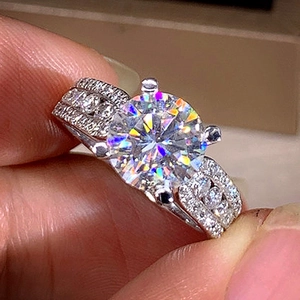 Elegant four-prong silver ring with large round zircon and triple-row pavé band for women