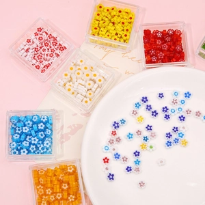 6mm millefiori glass flower beads set in a clear plastic storage box for DIY jewelry