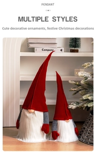 Close-up of red and grey Christmas gnome dolls with tall hats and white plush beards