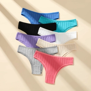 Set of eight ribbed cotton Brazilian panties in assorted colors on a minimalist background
