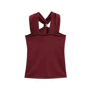 Sexy burgundy knit halter top featuring gold hardware accents and crossover back straps