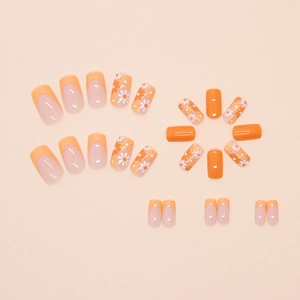 Kit de 24 faux ongles orange avec motifs de marguerites et style French manucure
