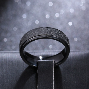 Macro shot of 6mm matte black titanium steel ring on professional jewelry stand