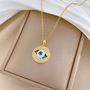 Elegant gold titanium steel necklace with a crystal-encrusted blue evil eye pendant