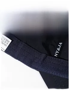 Detail view of the widened sweatband and 100% polyester wash label on baseball cap
