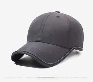 Detail of dark gray quick-dry baseball cap with side laser-cut ventilation holes