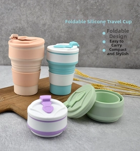 Collapsible silicone travel cup with portable lid in pastel pink and blue variants