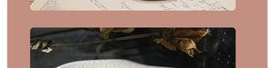 Detail of elegant white sandalwood hair stick with textured surface and dried flower accents