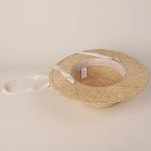 Handwoven flat top straw hat for women with long ribbons and elegant pearl accents
