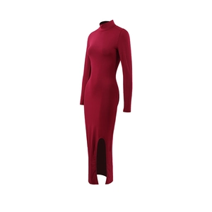 Detail of wine red slim fit dress showing the elegant side slit and mock neck tailoring