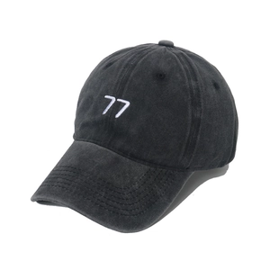 Washed black vintage baseball cap with white 77 embroidery and curved brim for sun protection