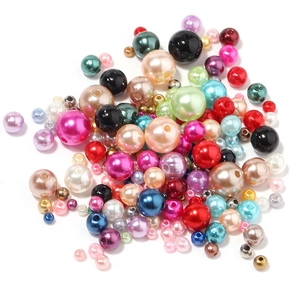 Mix of colorful pearlescent round ABS loose beads in various sizes for DIY craft projects